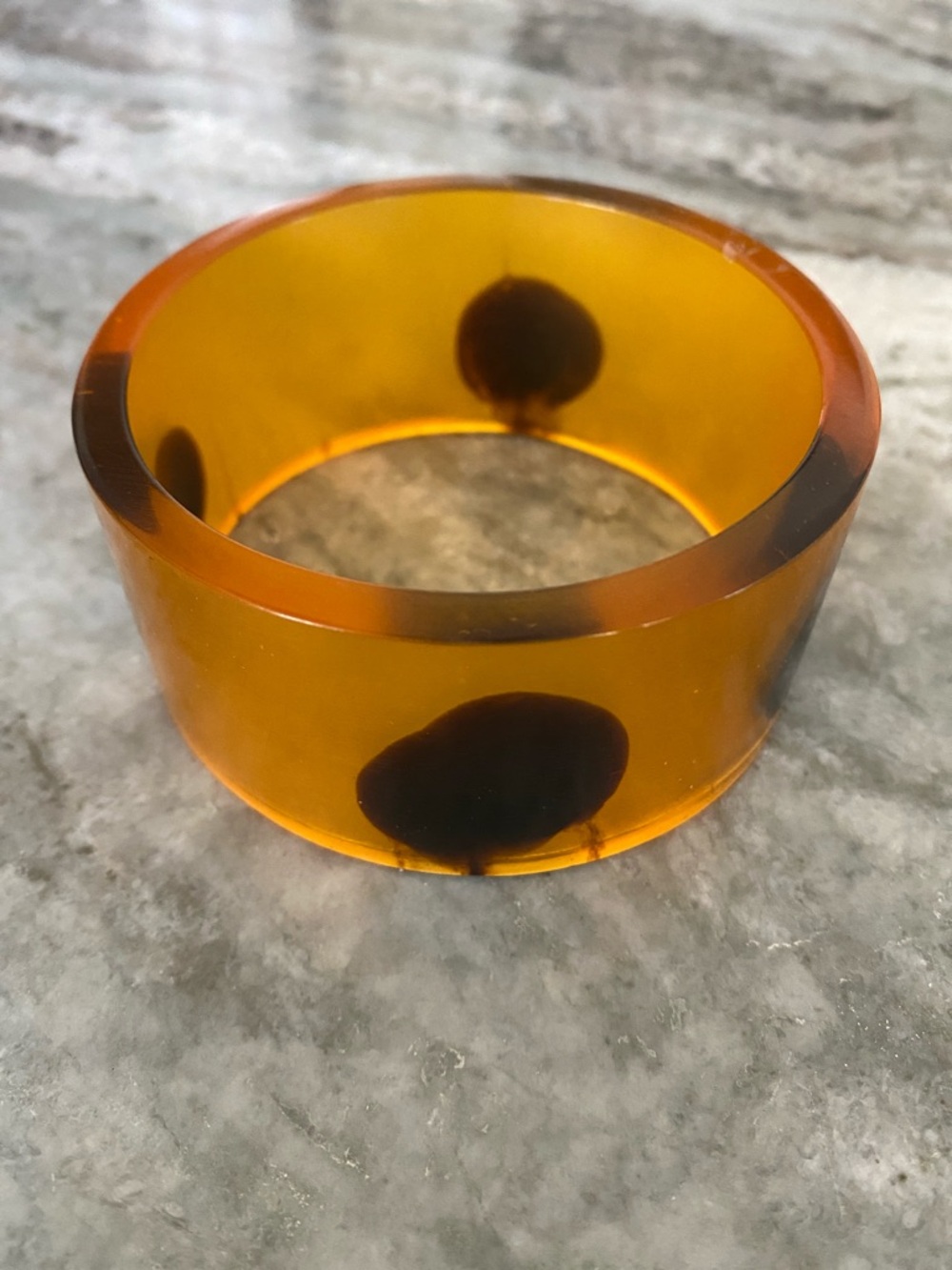 Vintage Translucent Amber lucite resin Bangle with Dark dots.